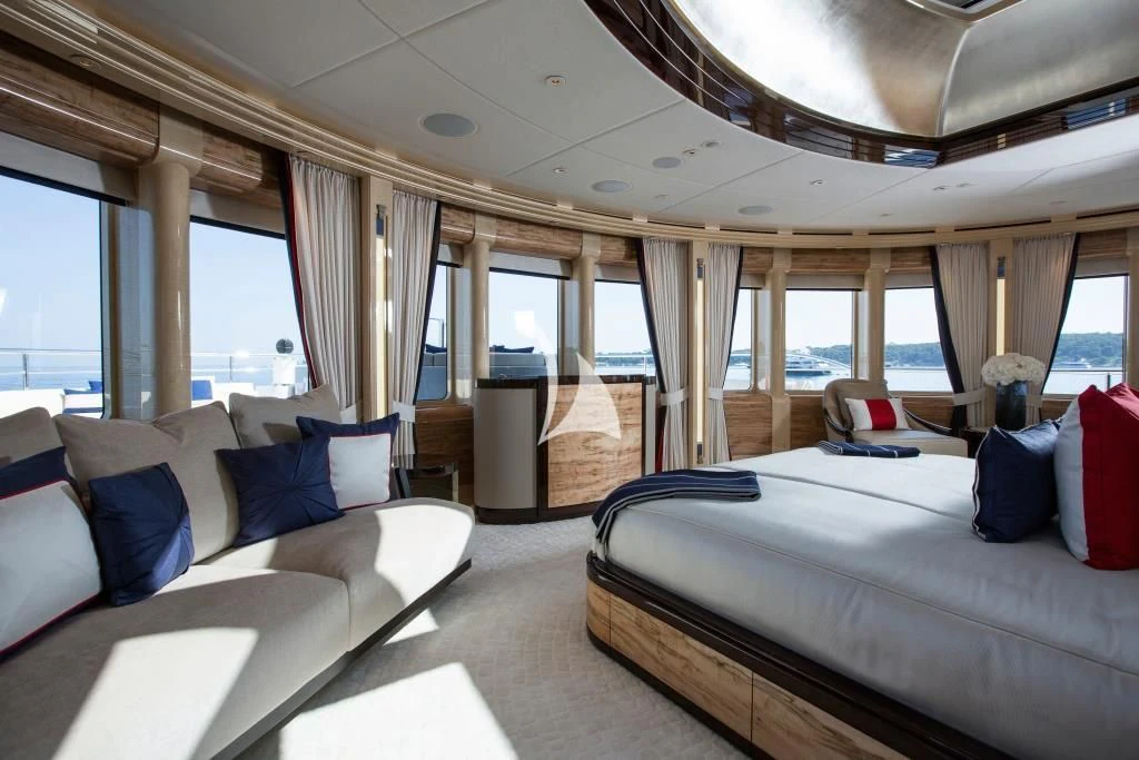 a room with a bed and a couch aboard ARIENCE Yacht for Sale