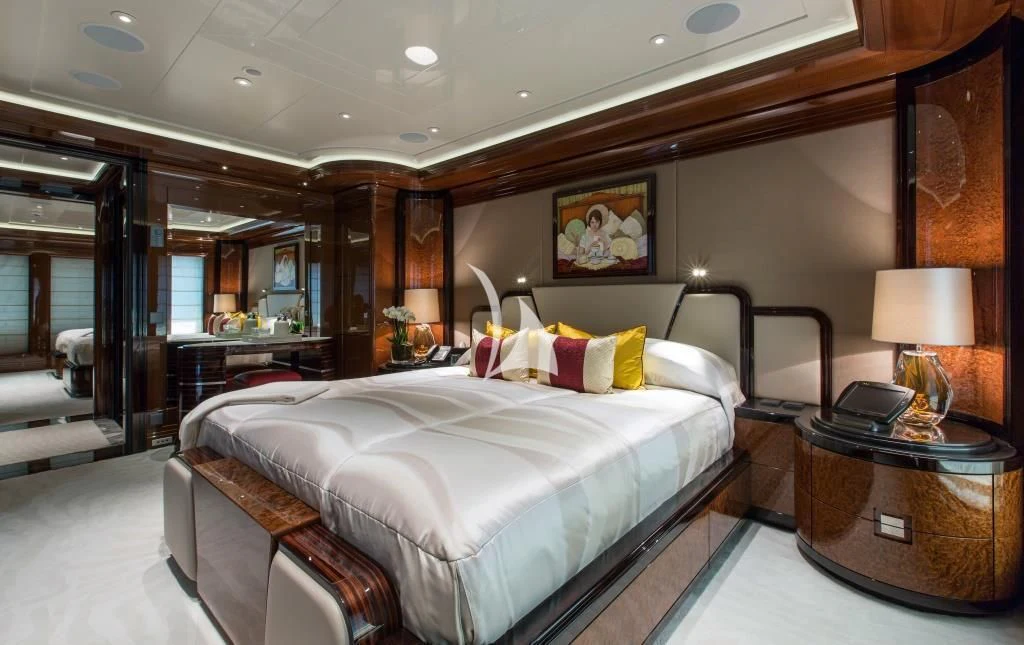 a bedroom with a bed and a desk aboard ARIENCE Yacht for Sale