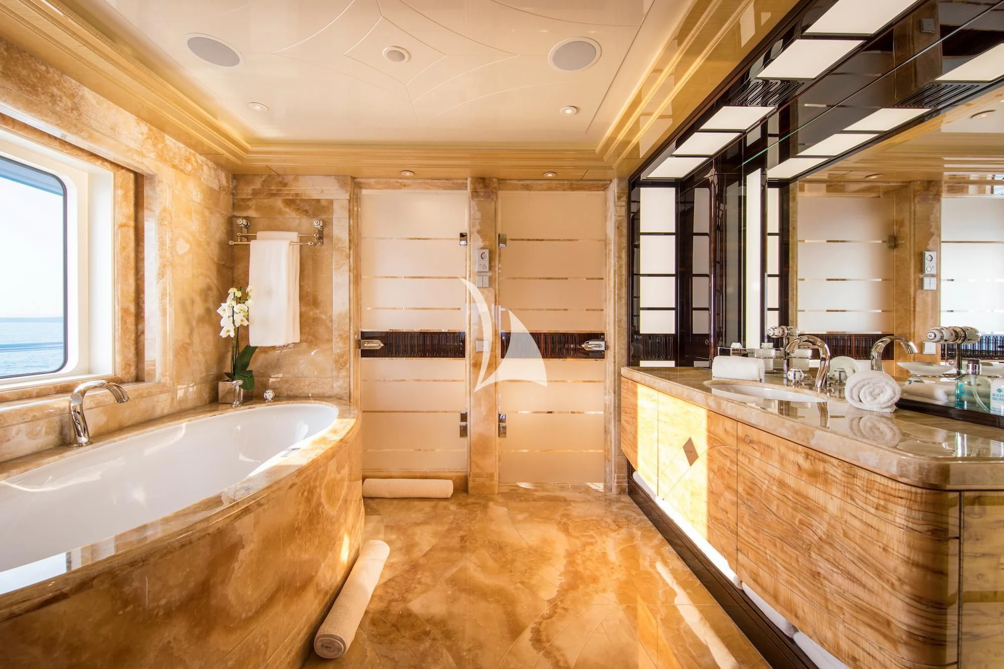 a bathroom with a tub and sink aboard ARIENCE Yacht for Sale