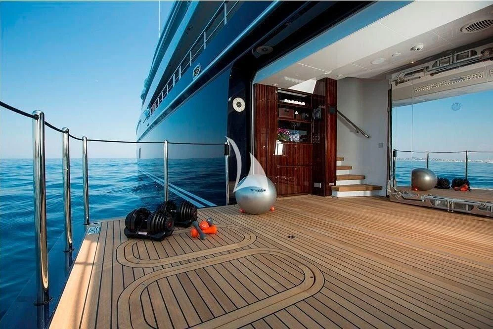 a deck with a large deck and a large window aboard ARIENCE Yacht for Sale