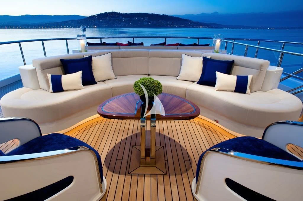 a white couch with a plant on it aboard ARIENCE Yacht for Sale