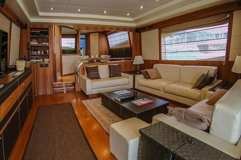 a living room with a couch and a coffee table aboard SPYRO Yacht for Sale