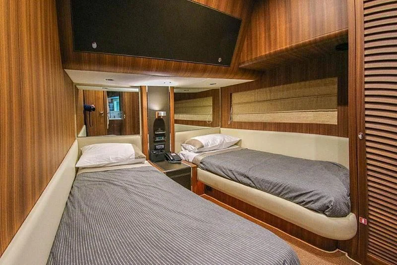a room with two beds aboard SPYRO Yacht for Sale