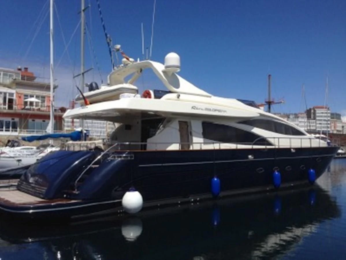 a boat docked at a pier aboard SPYRO Yacht for Sale