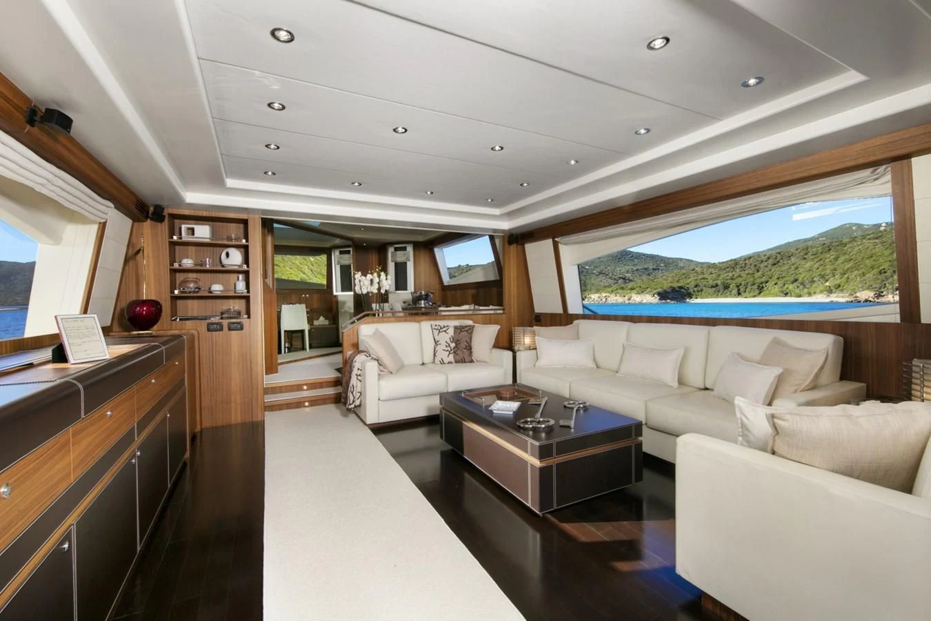 a living room with a large window aboard BLACK PEARL Yacht for Sale