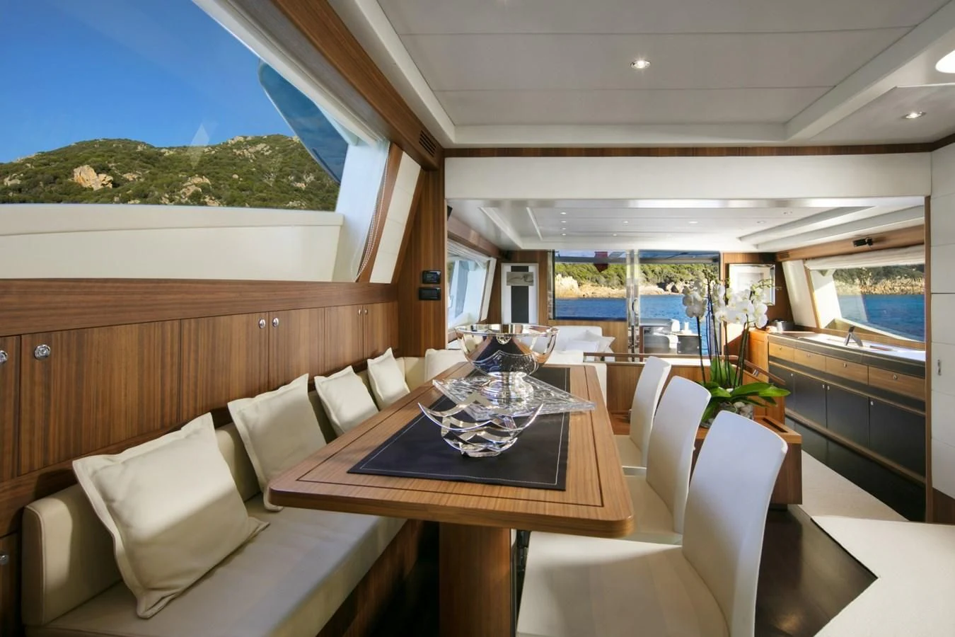 a room with a table chairs and a couch aboard BLACK PEARL Yacht for Sale
