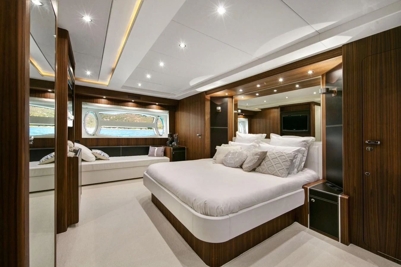 a room with a bed and a mirror aboard BLACK PEARL Yacht for Sale