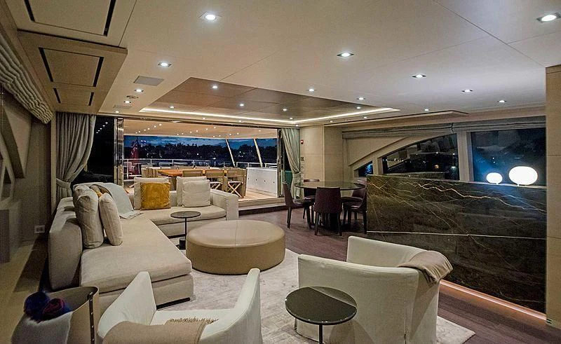 a living room with a large window aboard QUEEN D Yacht for Sale