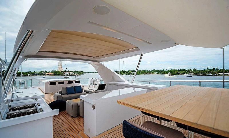 a large white tent with a deck and a pool aboard QUEEN D Yacht for Sale