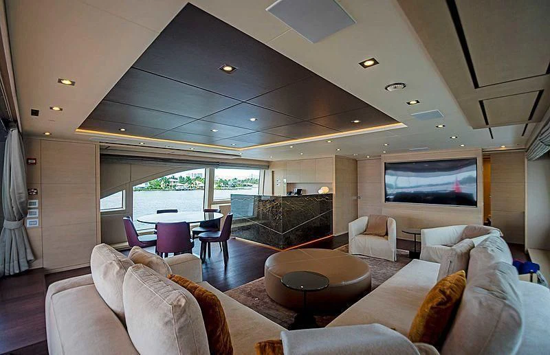a living room with a large window aboard QUEEN D Yacht for Sale