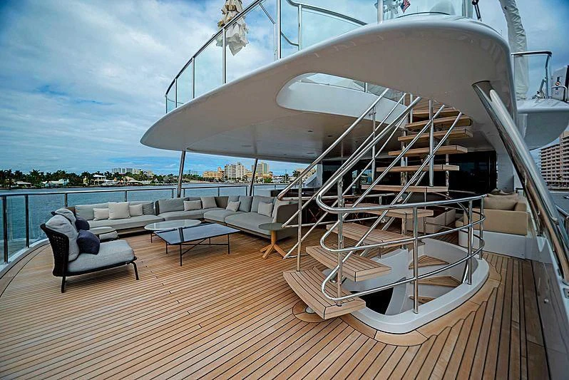 a large white boat on a deck aboard QUEEN D Yacht for Sale