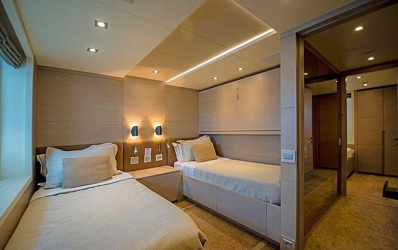 a room with a bed and a couch aboard QUEEN D Yacht for Sale