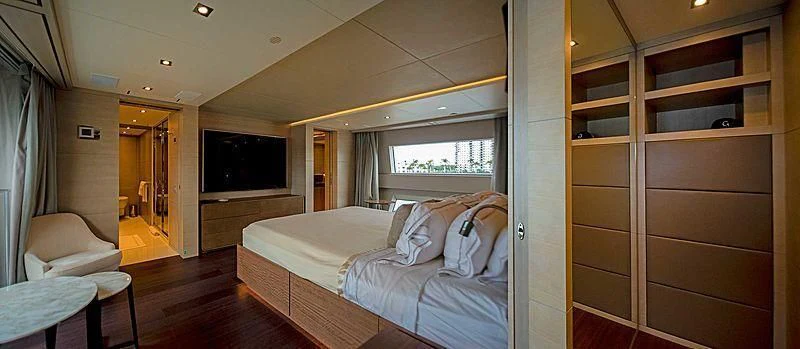 a room with a bed and a television aboard QUEEN D Yacht for Sale