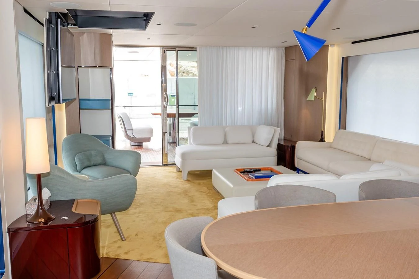 a living room with a couch and a table aboard AZIMUT GRANDE 26/25 Yacht for Sale