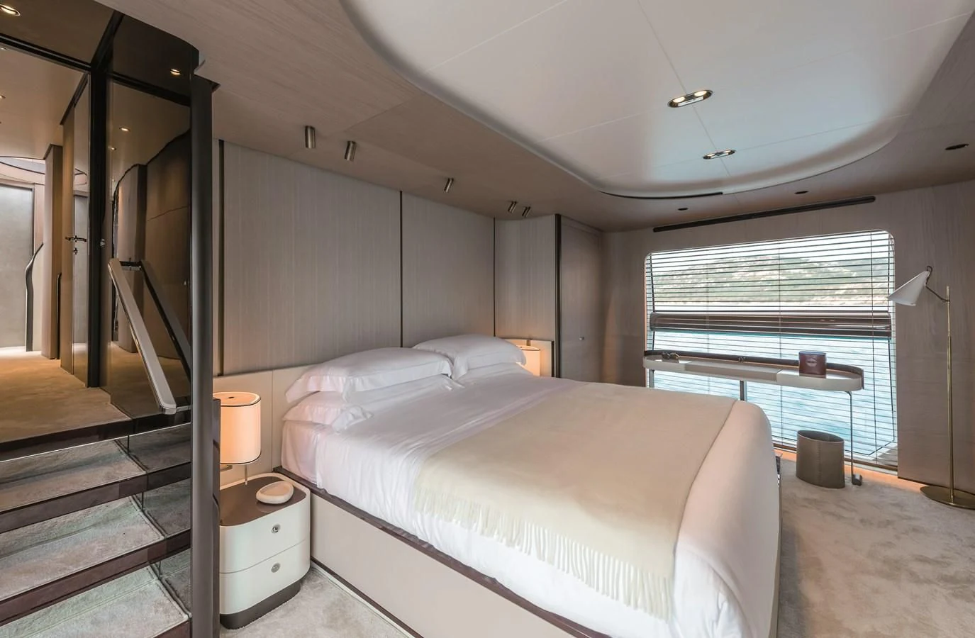 a bedroom with a bed and a window aboard AZIMUT GRANDE 26/25 Yacht for Sale