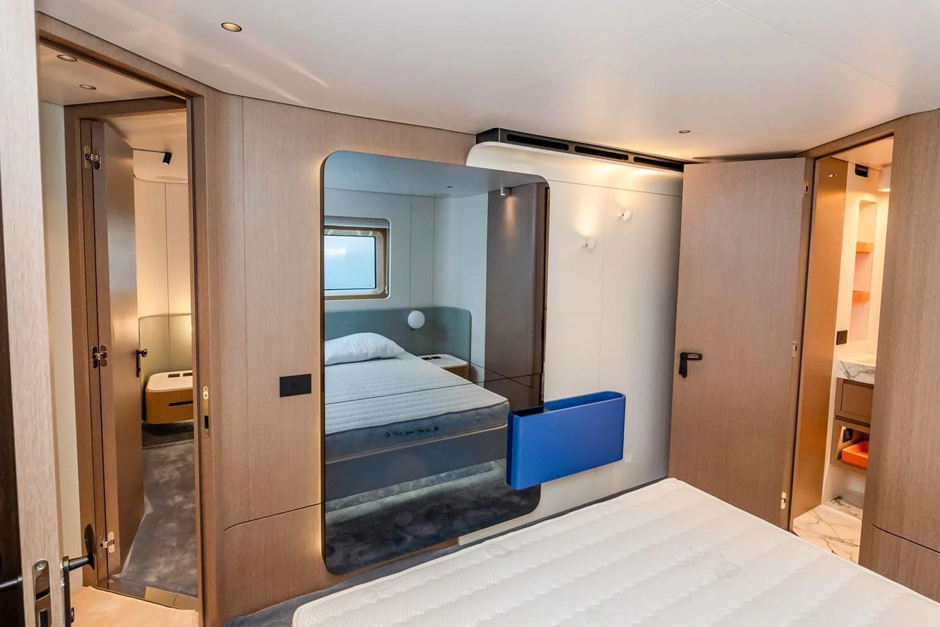 a room with a bed and a mirror aboard AZIMUT GRANDE 26/25 Yacht for Sale
