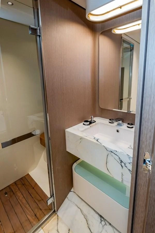 a bathroom with a sink and a bathtub aboard AZIMUT GRANDE 26/25 Yacht for Sale
