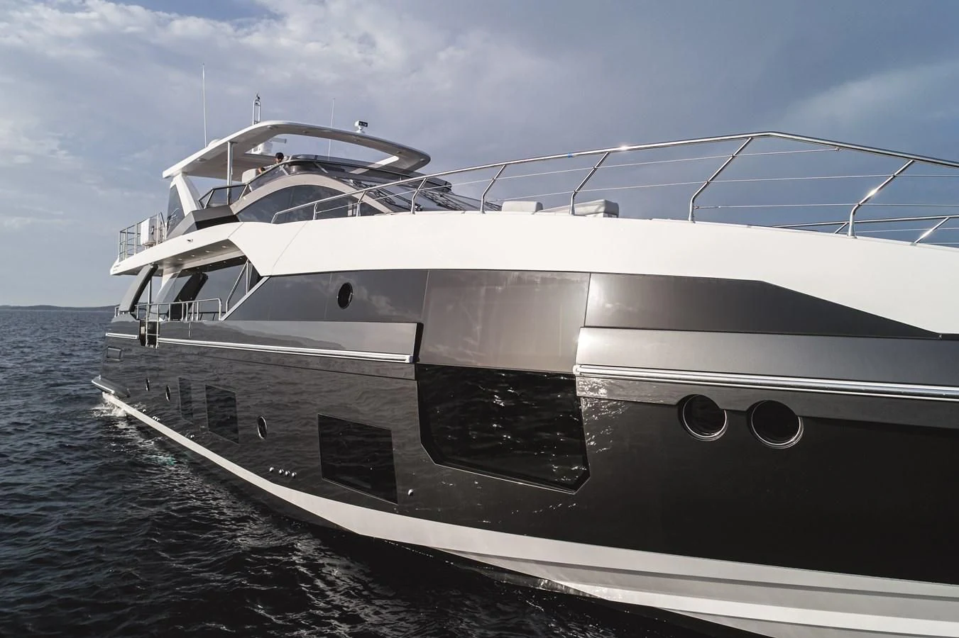 a white yacht on the water aboard AZIMUT GRANDE 26/25 Yacht for Sale