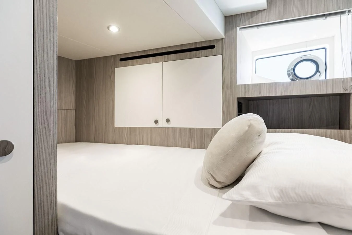 a bed with white sheets aboard AZIMUT GRANDE 26/25 Yacht for Sale