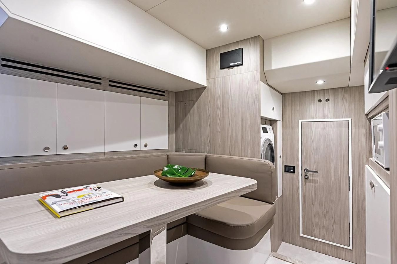 a kitchen with a table and a bowl of food aboard AZIMUT GRANDE 26/25 Yacht for Sale