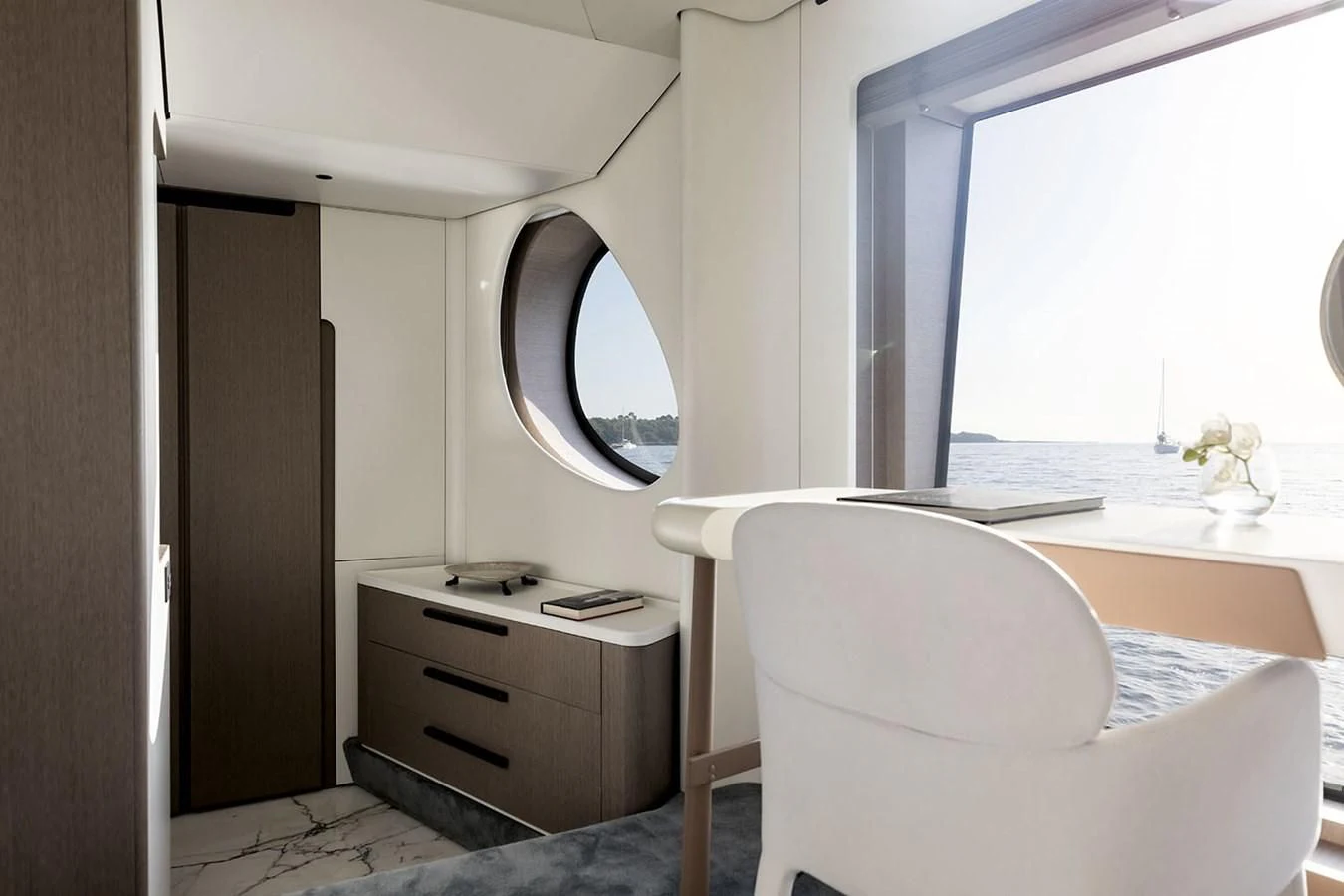 a white chair in a room aboard AZIMUT GRANDE 26/25 Yacht for Sale