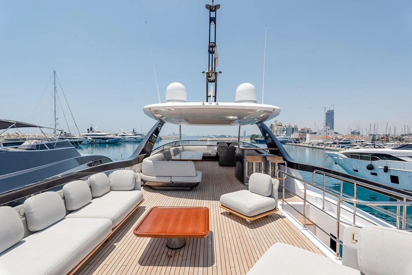 a deck with a large white boat and a large white ship in the background aboard AZIMUT GRANDE 26/25 Yacht for Sale