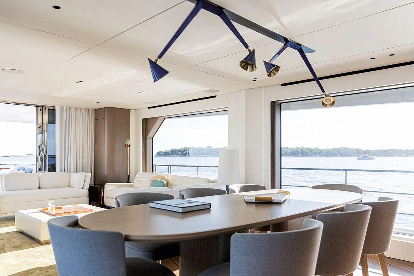 a large open living room with a large window aboard AZIMUT GRANDE 26/25 Yacht for Sale