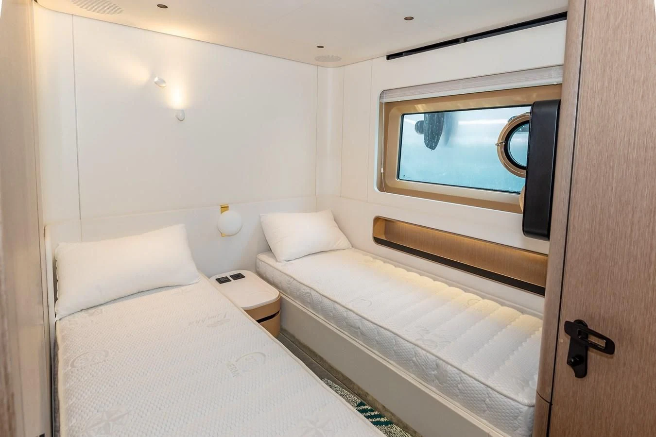a room with two beds aboard AZIMUT GRANDE 26/25 Yacht for Sale