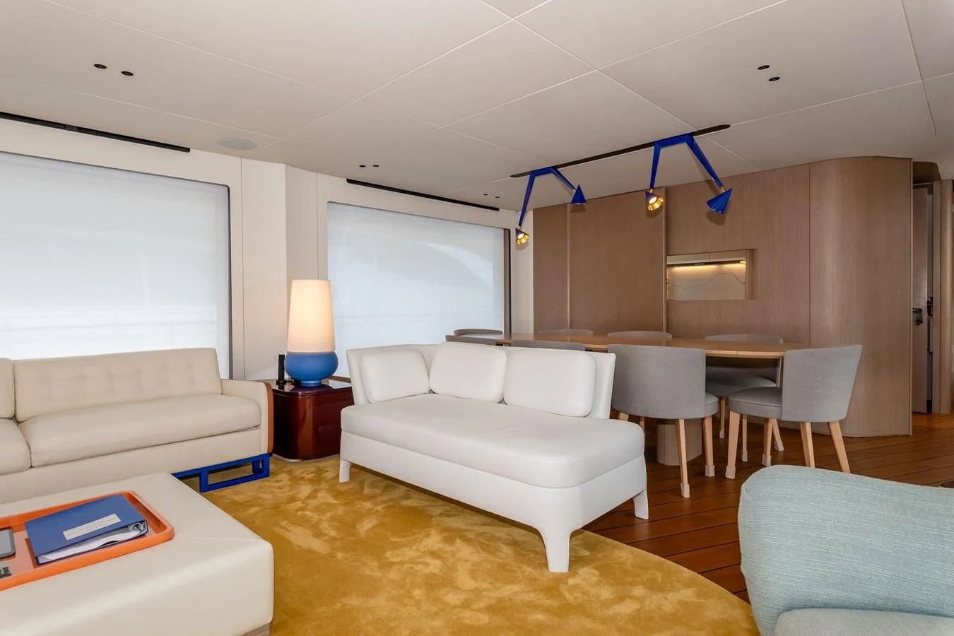 a living room with white couches aboard AZIMUT GRANDE 26/25 Yacht for Sale