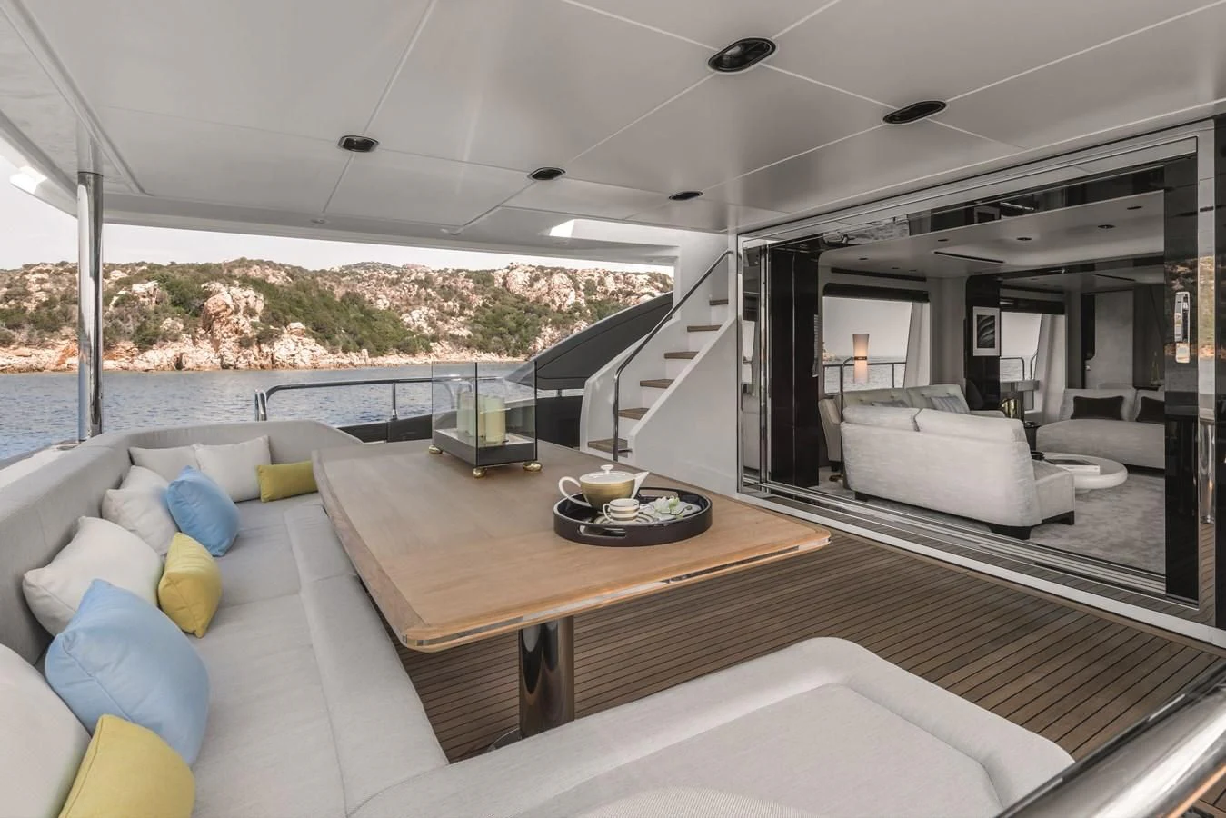 a modern living room with a large balcony aboard AZIMUT GRANDE 26/25 Yacht for Sale
