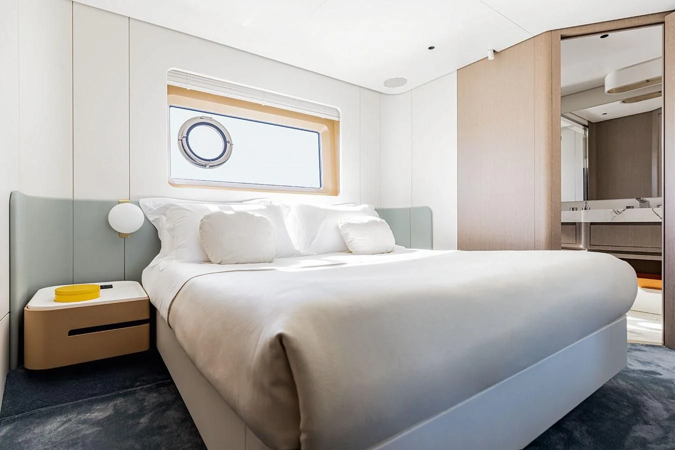 a bed with white sheets aboard AZIMUT GRANDE 26/25 Yacht for Sale