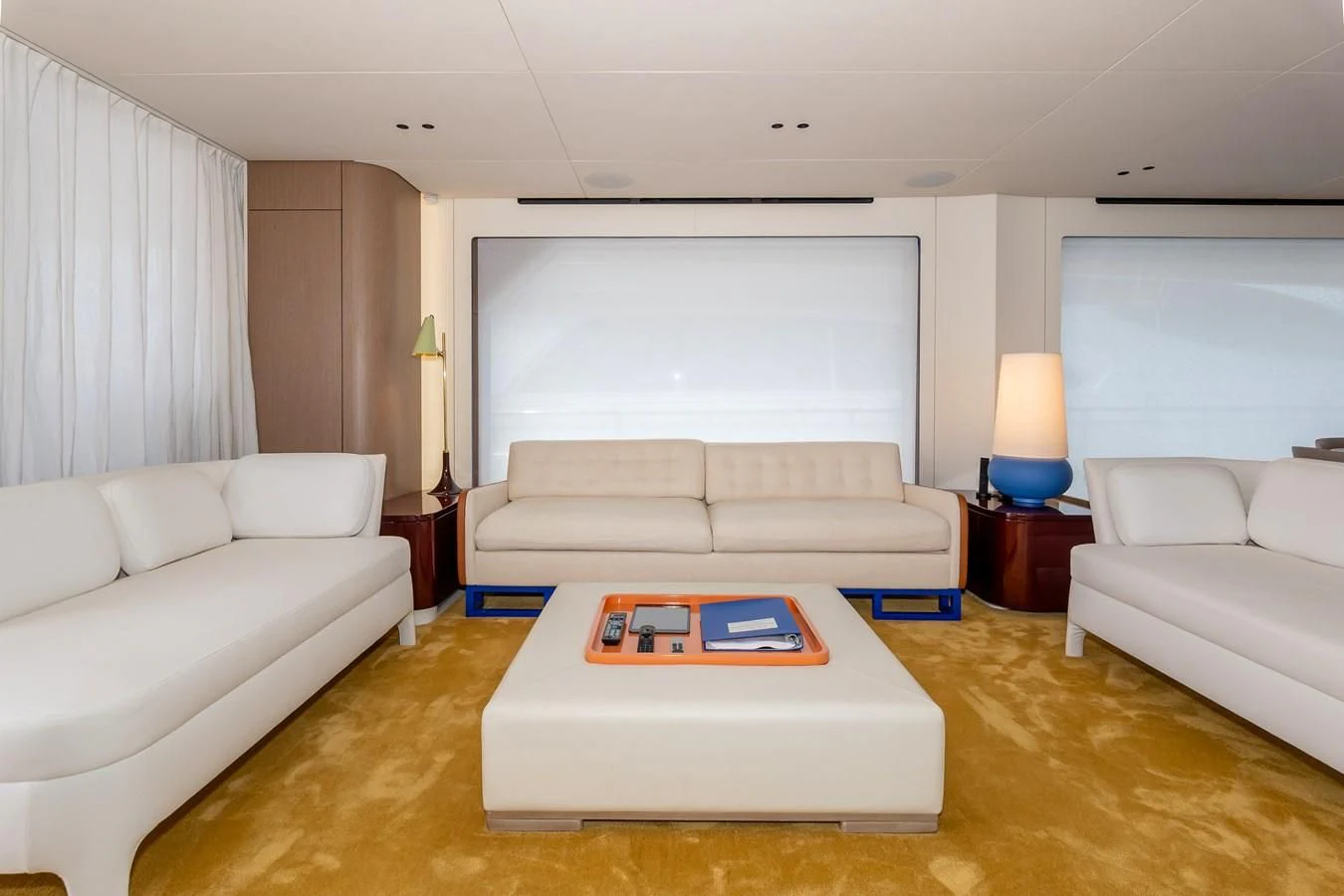 a living room with white couches aboard AZIMUT GRANDE 26/25 Yacht for Sale