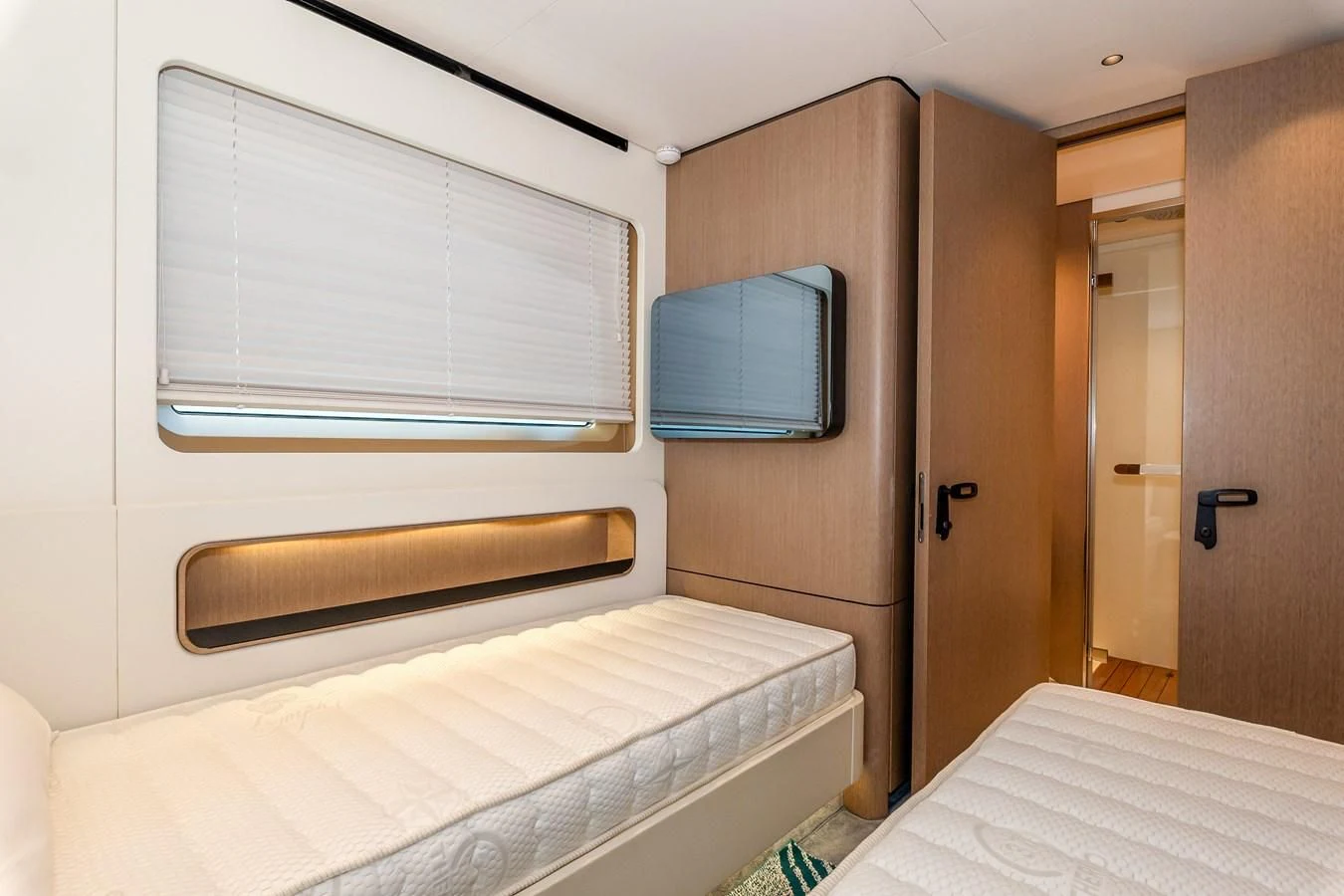 a room with a bed and a television aboard AZIMUT GRANDE 26/25 Yacht for Sale