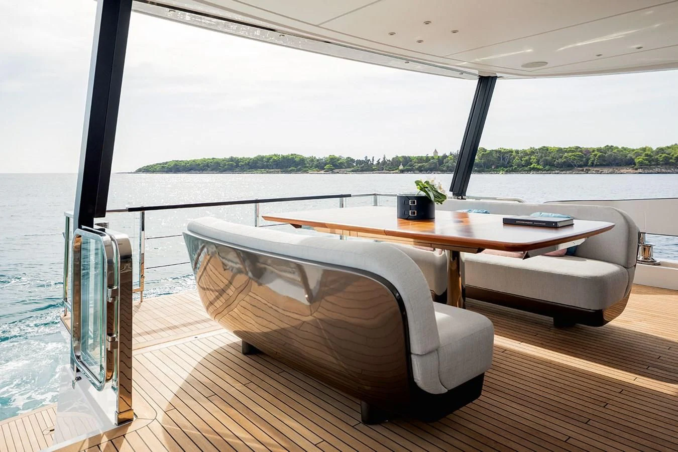 a table and chairs on a deck aboard AZIMUT GRANDE 26/25 Yacht for Sale
