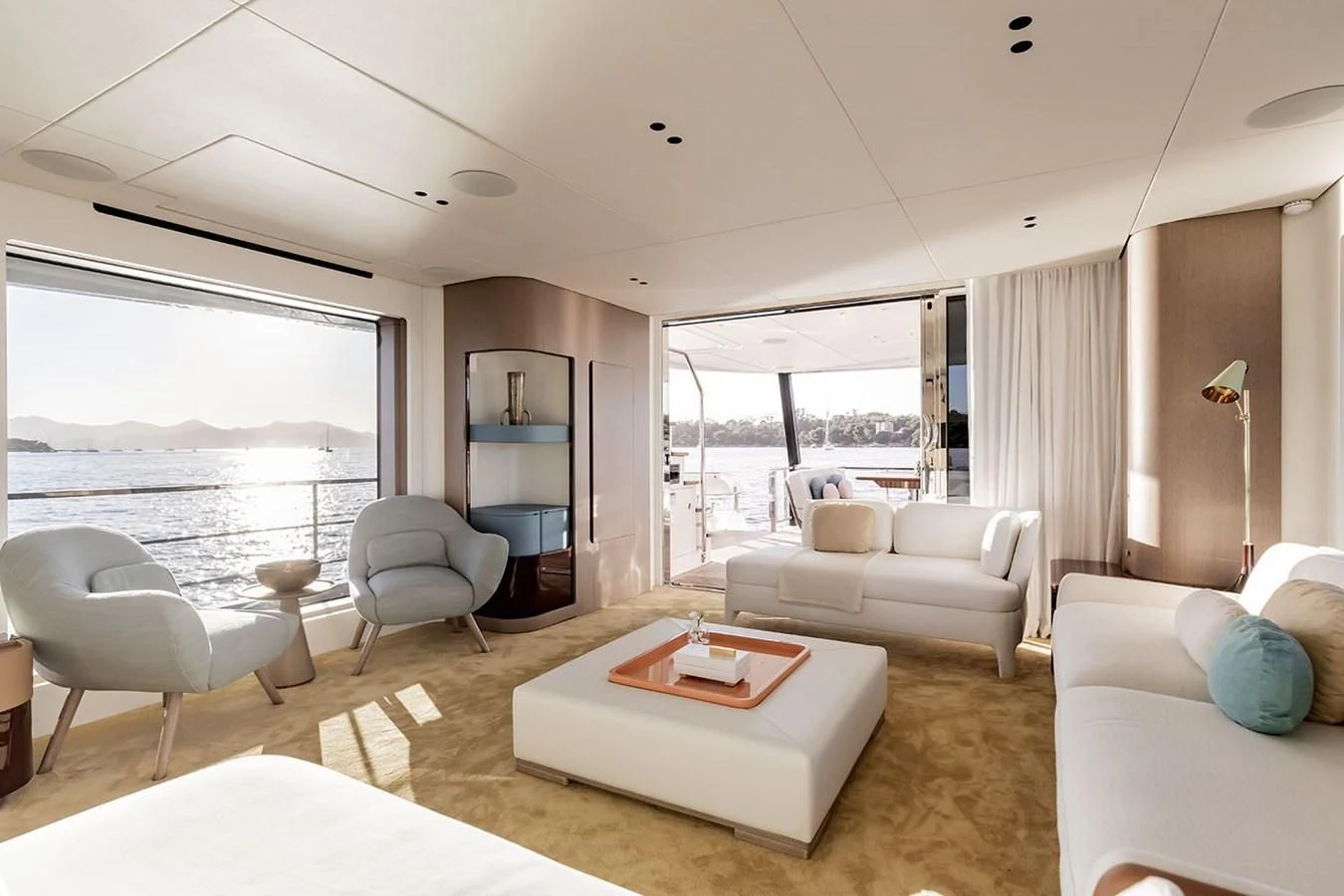 a living room with a large window aboard AZIMUT GRANDE 26/25 Yacht for Sale