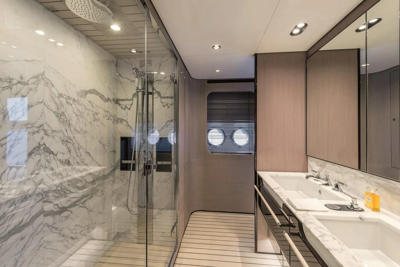 a bathroom with a shower unit and sinks aboard AZIMUT GRANDE 26/25 Yacht for Sale