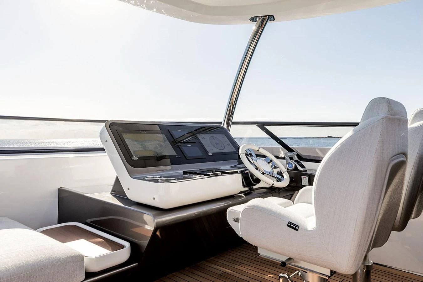 a car with a screen and a steering wheel aboard AZIMUT GRANDE 26/25 Yacht for Sale