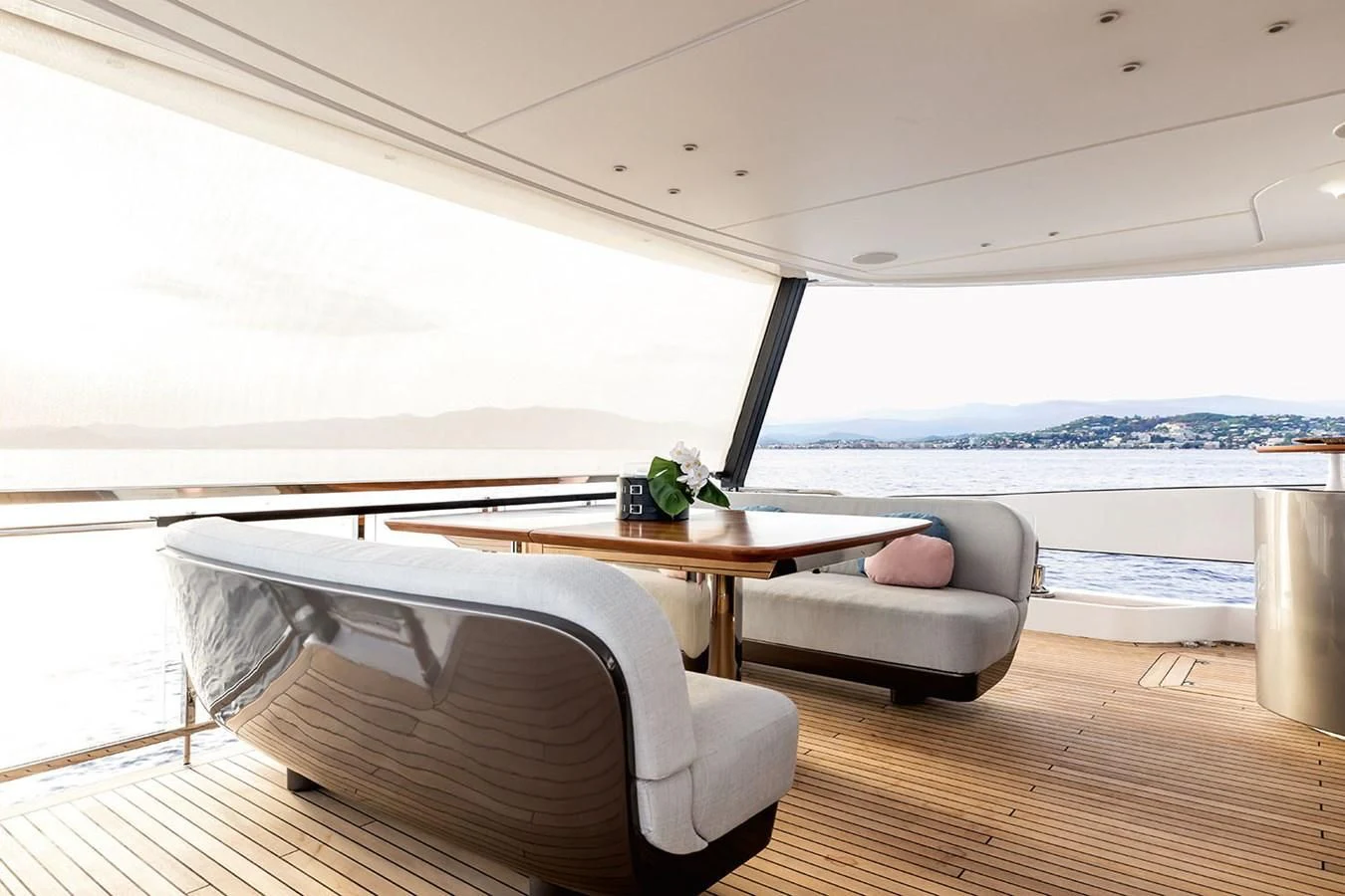 a living room with a large window aboard AZIMUT GRANDE 26/25 Yacht for Sale