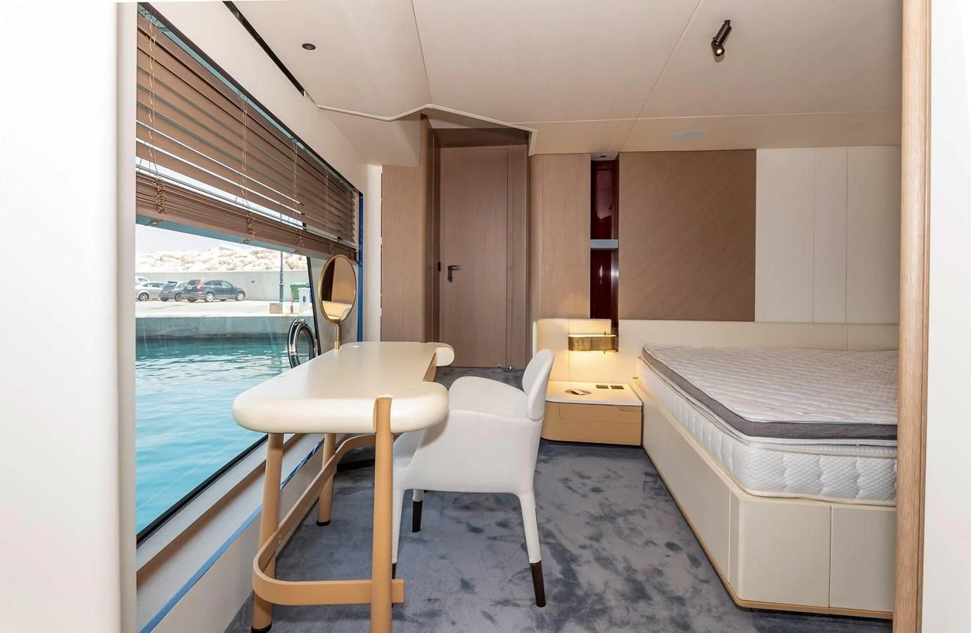 a room with a table and chairs aboard AZIMUT GRANDE 26/25 Yacht for Sale