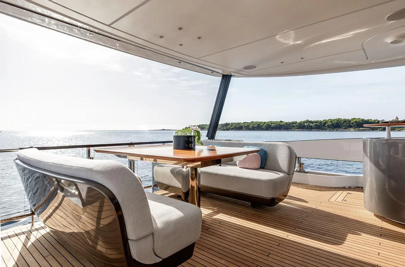 a table and chairs on a deck aboard AZIMUT GRANDE 26/25 Yacht for Sale