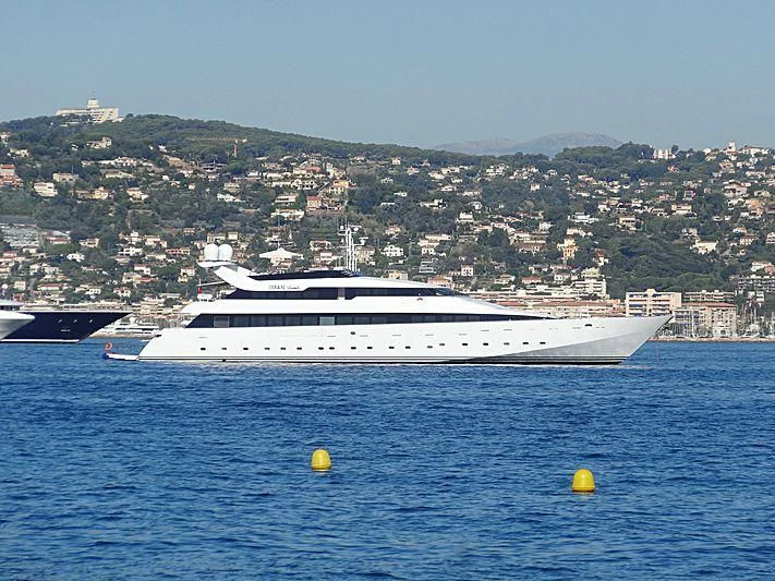 a large ship in the water aboard IMAN Yacht for Sale