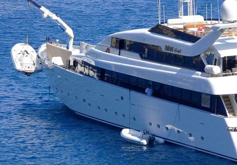 a large white boat in the water aboard IMAN Yacht for Sale