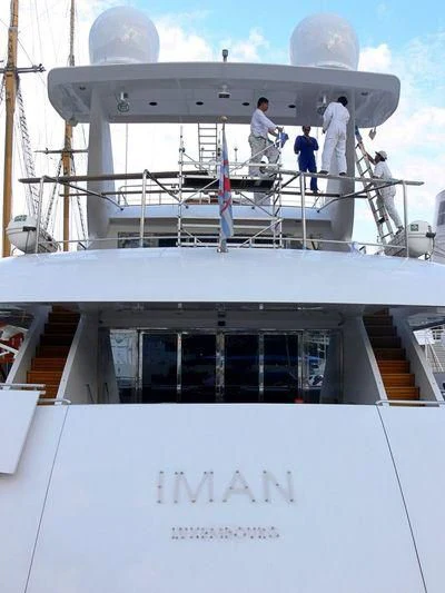 a group of men on a boat aboard IMAN Yacht for Sale