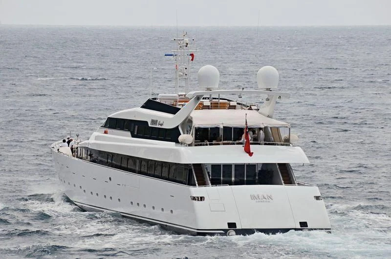 a white boat in the water aboard IMAN Yacht for Sale