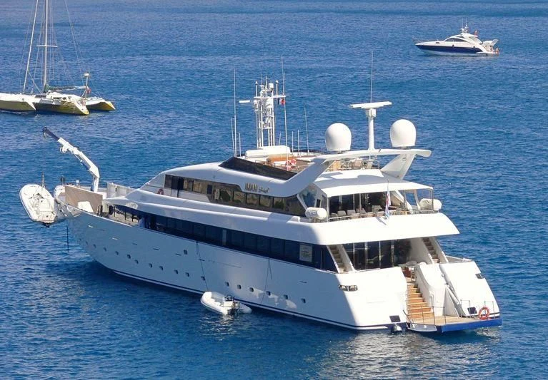 a large white boat in the water aboard IMAN Yacht for Sale