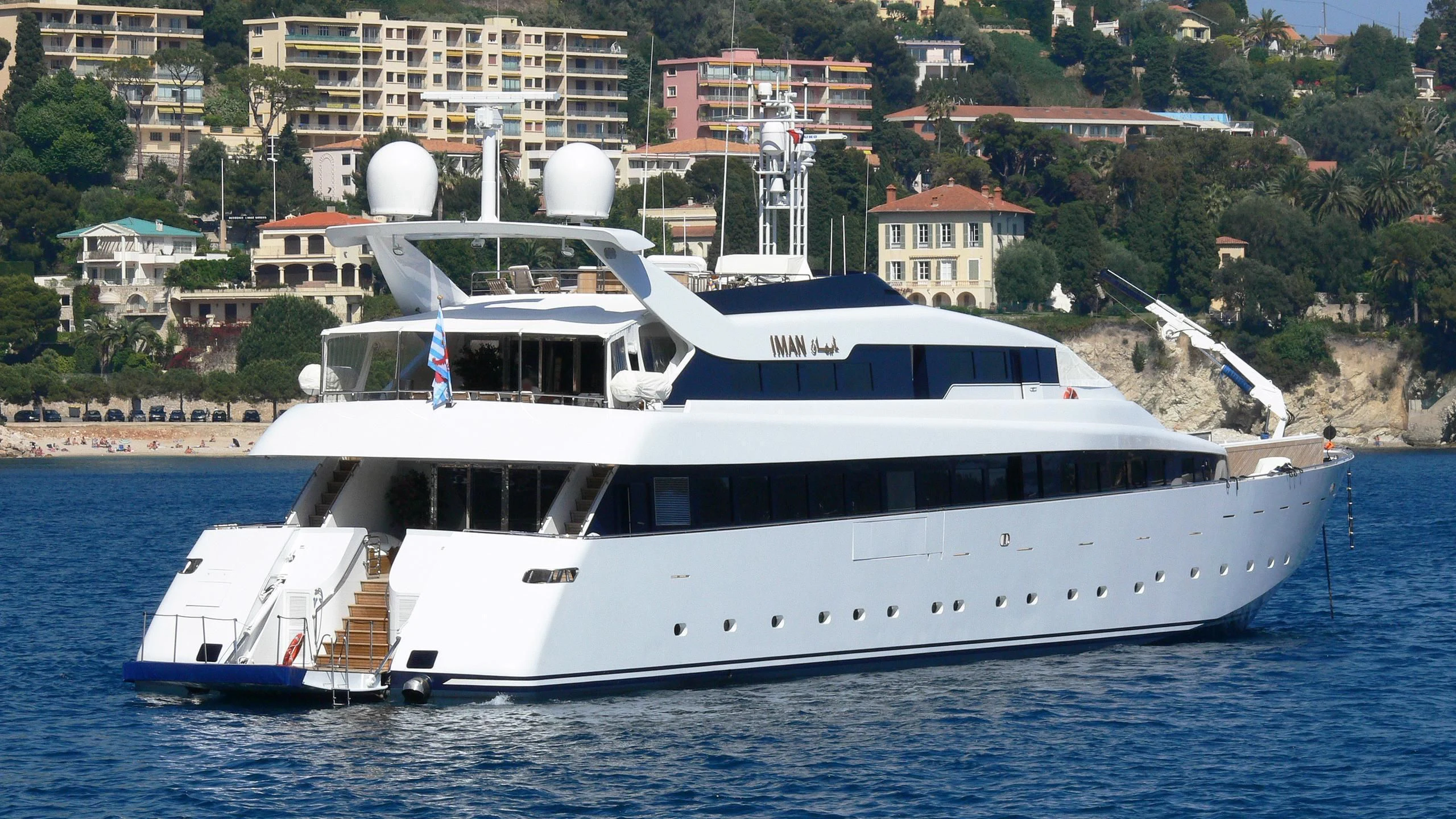 a large white boat in the water aboard IMAN Yacht for Sale