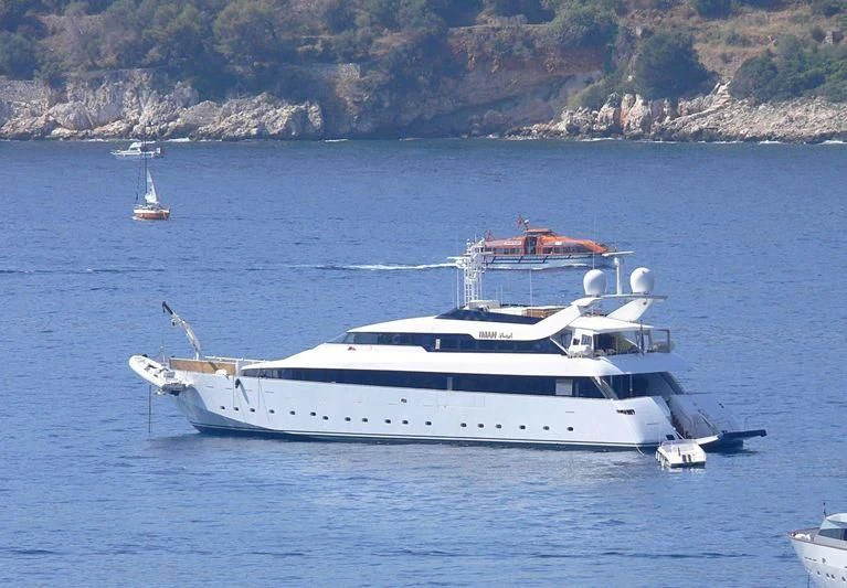 a white yacht in the water aboard IMAN Yacht for Sale