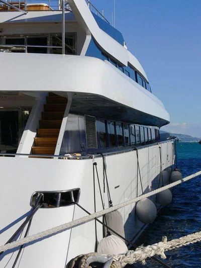 a boat with a staircase on the side aboard IMAN Yacht for Sale
