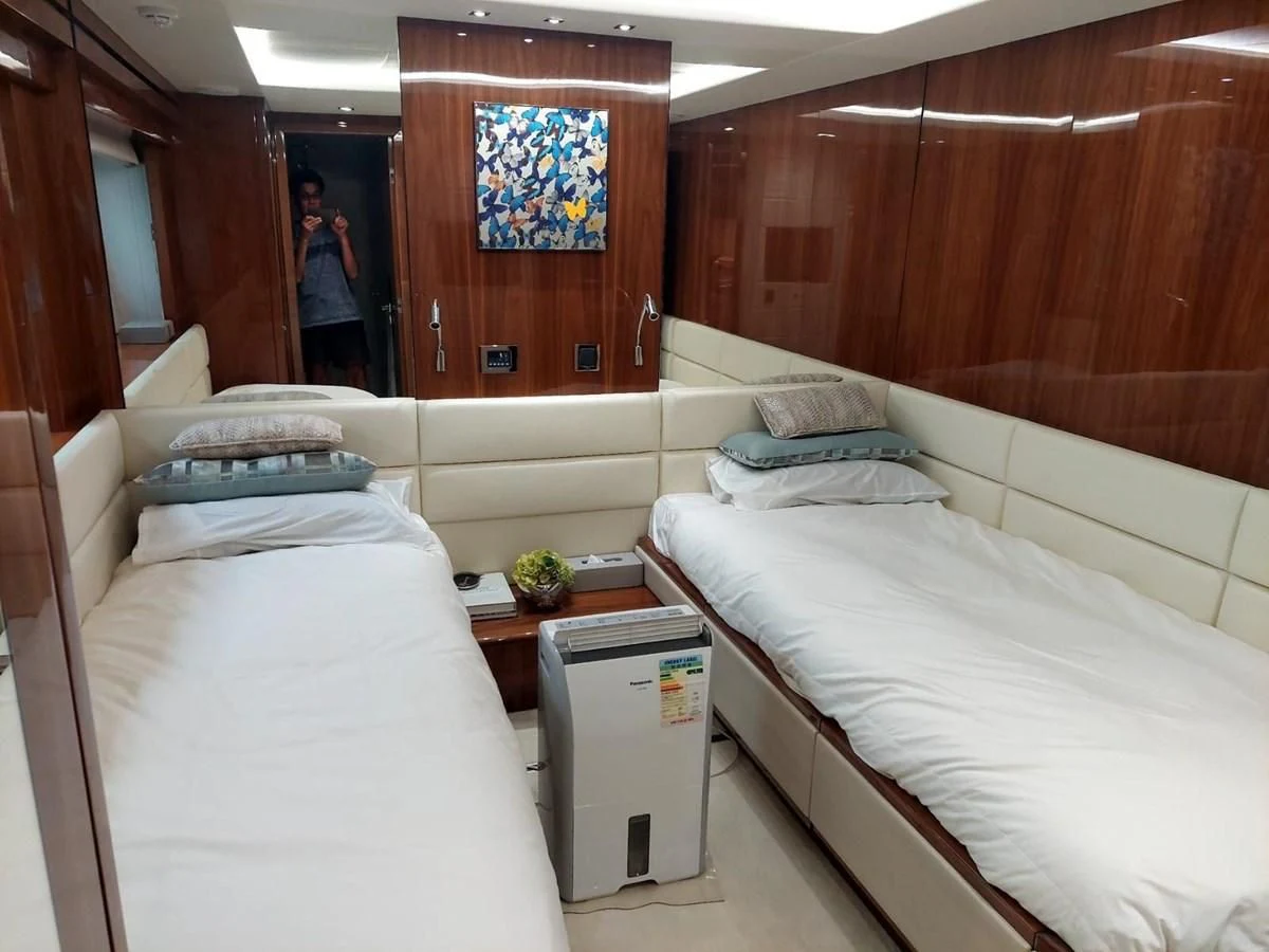 a room with beds and a person standing in the doorway aboard SUNSEEKER 75 YACHT Yacht for Sale