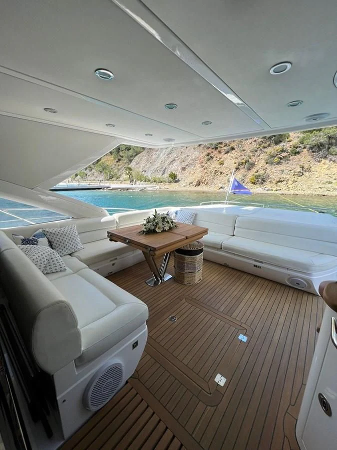 a room with a table and chairs aboard SUNSEEKER 75 YACHT Yacht for Sale